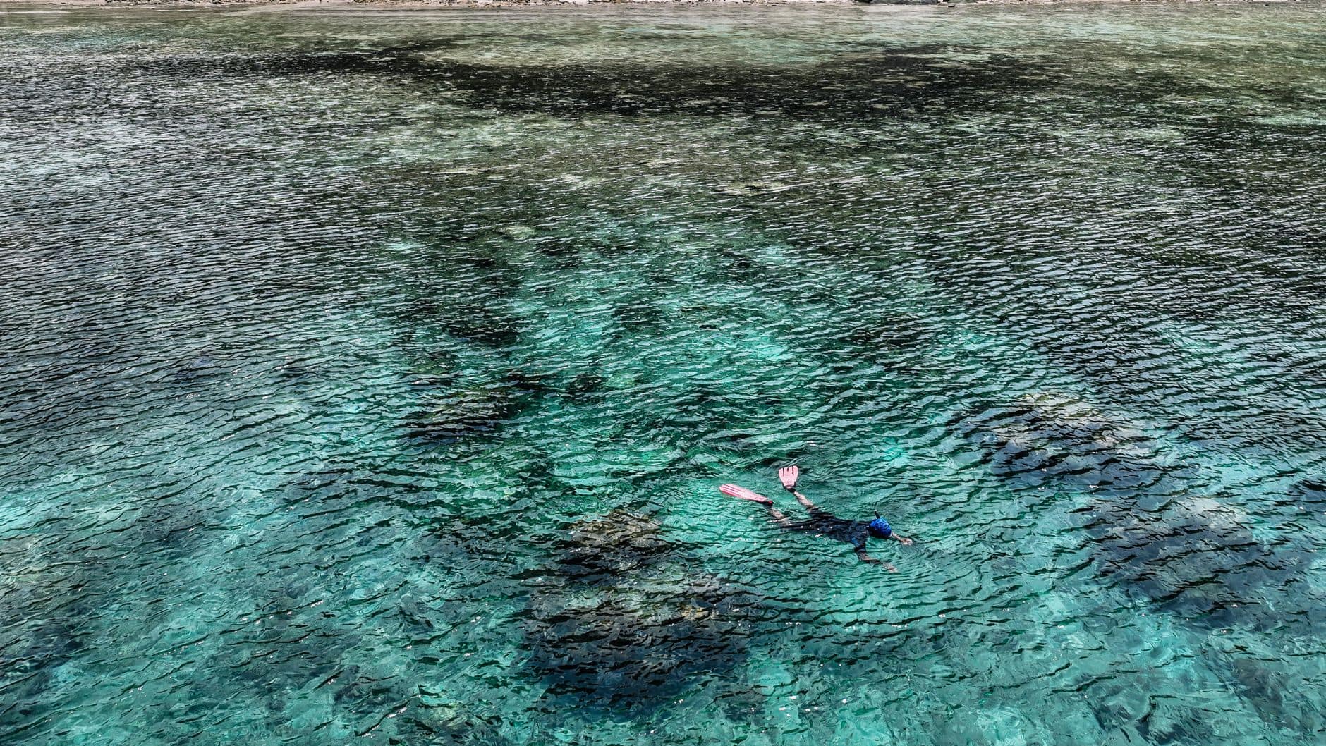 Snorkeling over coral at Blue Lagoon, Padang Bai, east Bali