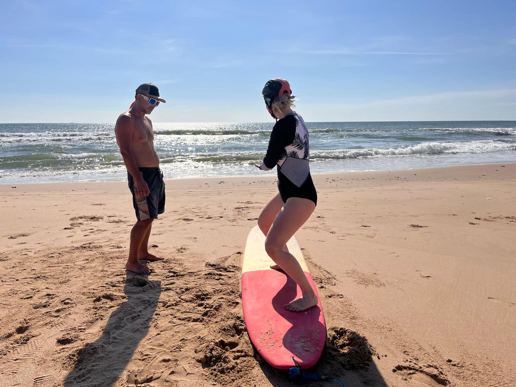 Beginner surf lesson on a sandy Bali beach break